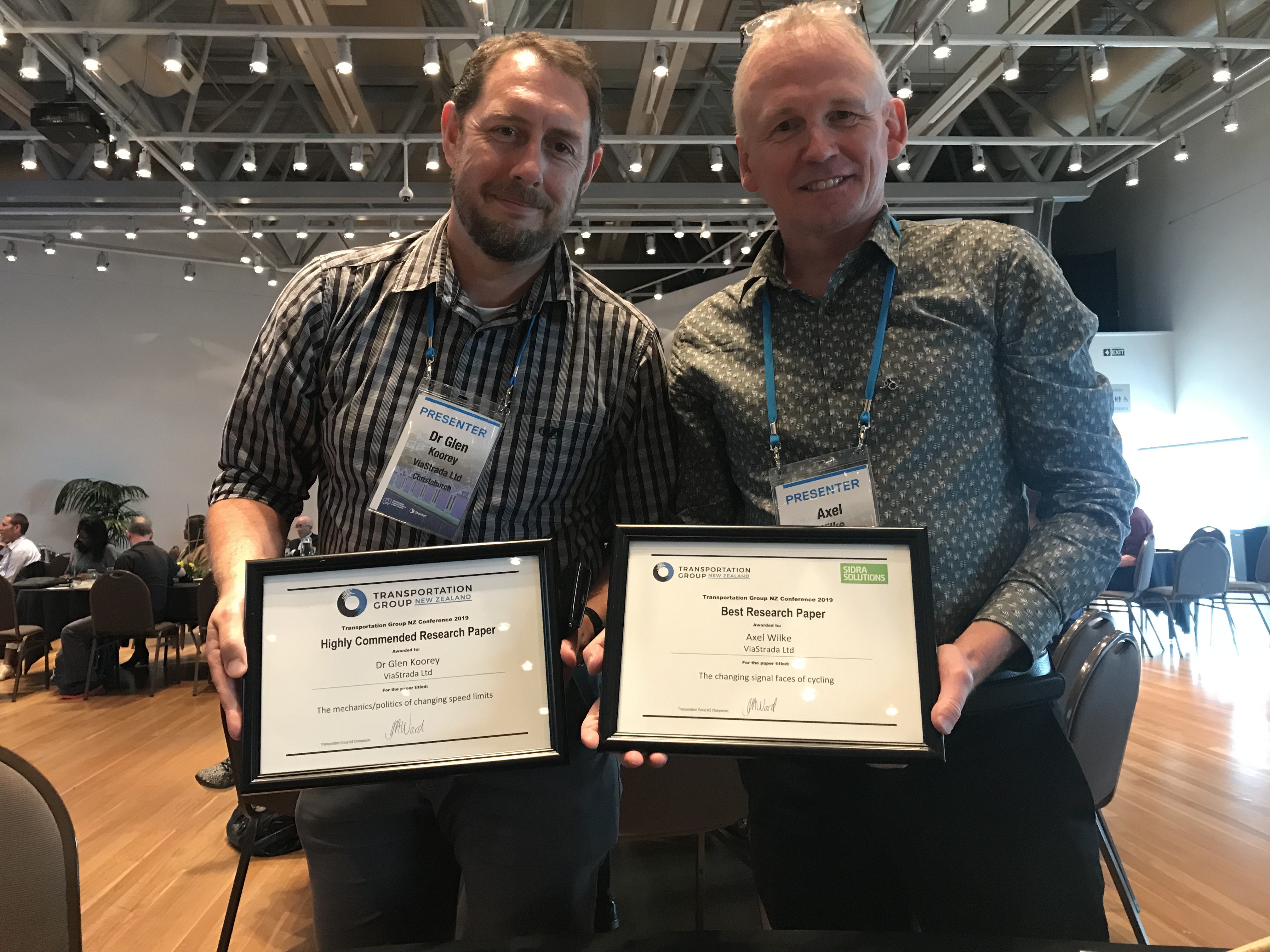 Glen and Axel with their research paper award certificates