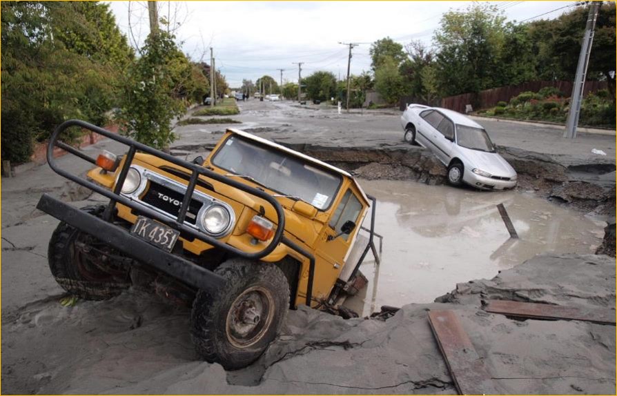 Cars in quake sinkhole