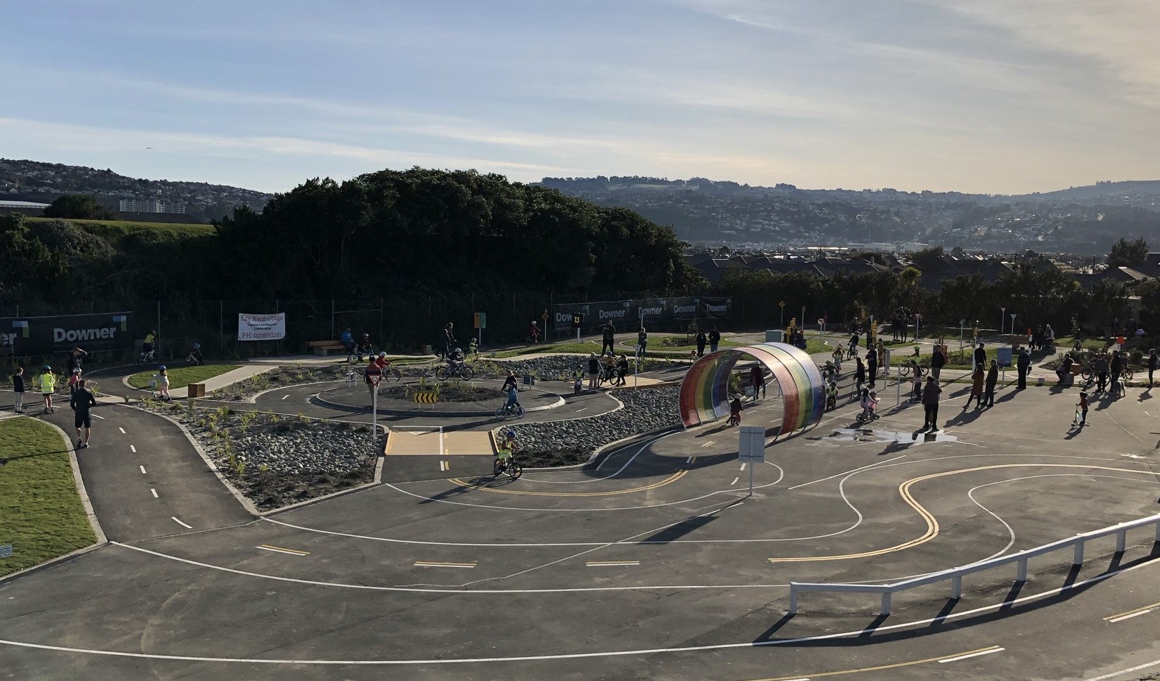 The completed junior road safety cycle track being used by children and families on a sunny Dunedin day