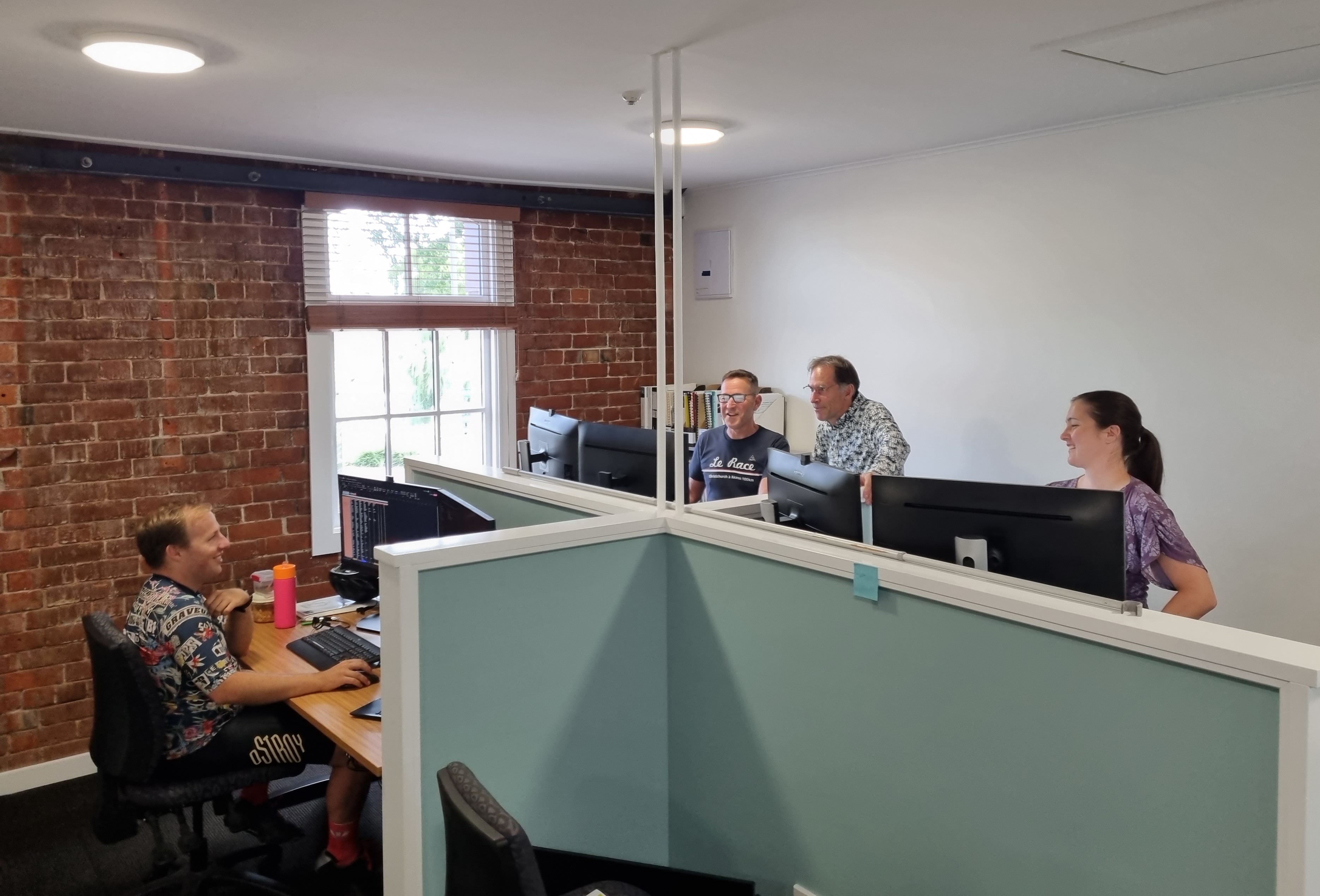 David, Warren, John and Megan working hard in our new office space