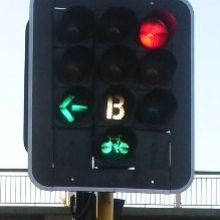 Traffic Signal with green lights for bikes.