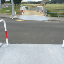 A pathway road crossing with "banana rails" - a type of access restriction devices this is not supported by the auditors or the NZ Transport Agency.
