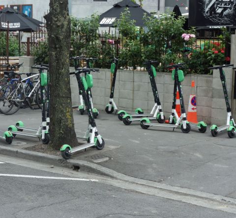 Lots of parked lime scooters