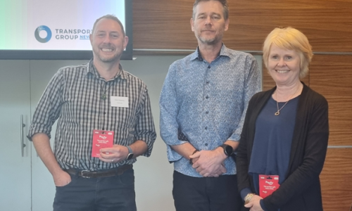 Glen and Julie receiving the award from Andrew Murray