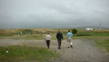 Photo of VS staff walking at rural gravel road