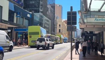 Willis Street being used by buses, cars and pedestrians